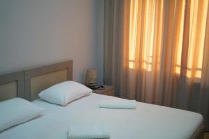 Postel nebo postele na pokoji v ubytování Tskaltubo Hotel Terrace
