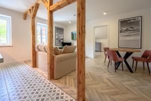 a living room with a couch and a table at Pod Gołębiem Contactless check in 24h in Karpacz