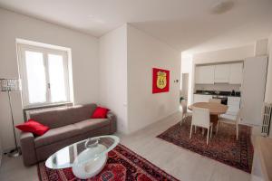 a living room with a couch and a table at Le Case di Grazia in Lecco