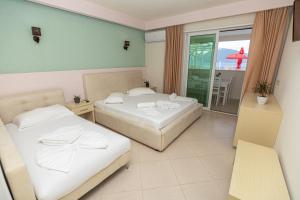 Postel nebo postele na pokoji v ubytování Hotel Picasso