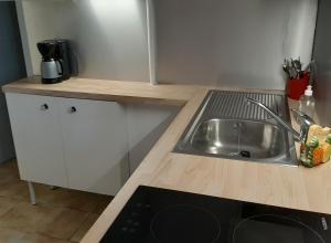 a kitchen with a sink and a counter top at Le Fontana in Nice