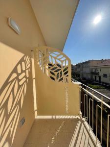 a balcony with a view of a building at Pianohome Sorrento in Piano di Sorrento