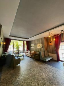 a living room with a couch and a table at Akpinar Hotel in Uzungöl +103 photos
