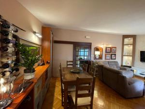 a living room with a table and a couch at La Grande Apartments in Kotor