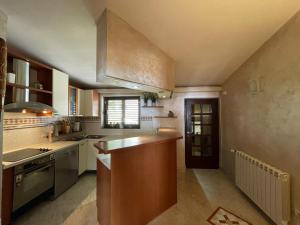 a kitchen with a sink and a counter top at La Grande Apartments in Kotor