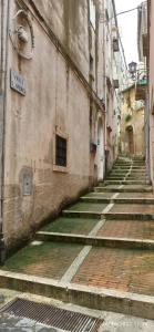 an alley with steps leading up to a building at Casa M&M: Campobasso in Campobasso