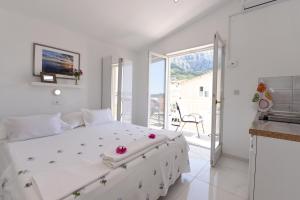 Posteľ alebo postele v izbe v ubytovaní Makarska sea view rooms