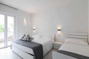 Imagen de la galería de Borgo degli Ulivi Residence di Olympic Garda Lake, en Toscolano Maderno