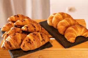 a group of croissants and other pastries on a table at XENIA HOTEL in Sfakia
