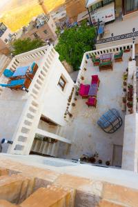 an aerial view of a building with chairs and tables at KASR-I REYYAN in Mardin