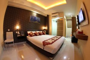 Giường trong phòng chung tại Antoni Hotel