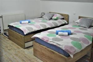 Posteľ alebo postele v izbe v ubytovaní Guest House Tonka