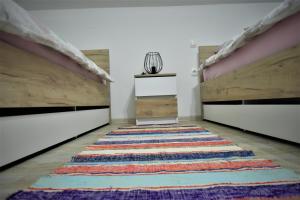 Posteľ alebo postele v izbe v ubytovaní Guest House Tonka