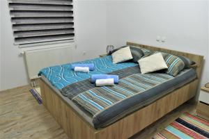 Posteľ alebo postele v izbe v ubytovaní Guest House Tonka