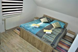 Posteľ alebo postele v izbe v ubytovaní Guest House Tonka