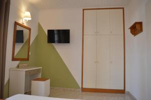 A bed or beds in a room at Babis Apartments & Studios Iremia