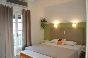 A bed or beds in a room at Babis Apartments & Studios Iremia