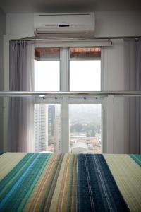 Un pat sau paturi într-o cameră la Apartamento Triplex Place Vendome
