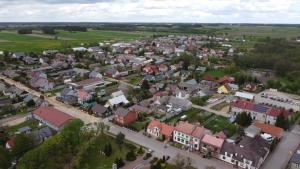 an aerial view of a small town with houses at U Wileńskich in Wizna