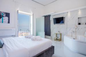 Voodi või voodid majutusasutuse Naro Suites and Rooms toas