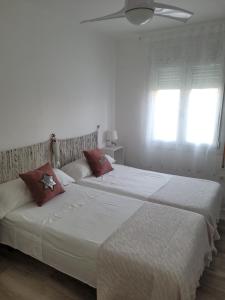 Posteľ alebo postele v izbe v ubytovaní Apartamento Apolo