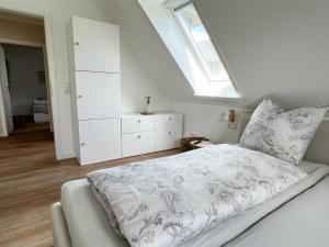 Postel nebo postele na pokoji v ubytování Dyke Appartements