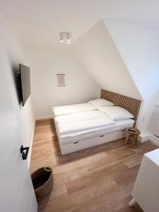 Postel nebo postele na pokoji v ubytování Dyke Appartements