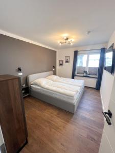 Postel nebo postele na pokoji v ubytování Dyke Appartements