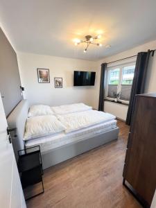 Postel nebo postele na pokoji v ubytování Dyke Appartements