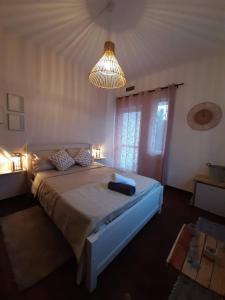 מיטה או מיטות בחדר ב-Eden Villa