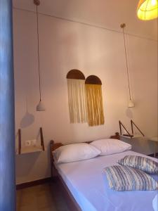 Postel nebo postele na pokoji v ubytování Amelia Beach Apartments