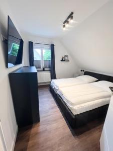 Postel nebo postele na pokoji v ubytování Dyke Appartements