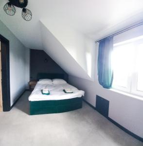 Posteľ alebo postele v izbe v ubytovaní Pogodny Domek