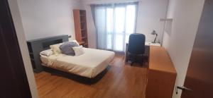 A bed or beds in a room at CASUAL SUITES GANDIA CENTRO