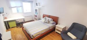 A bed or beds in a room at CASUAL SUITES GANDIA CENTRO