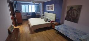 A bed or beds in a room at CASUAL SUITES GANDIA CENTRO