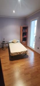A bed or beds in a room at CASUAL SUITES GANDIA CENTRO