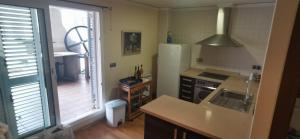 A kitchen or kitchenette at CASUAL SUITES GANDIA CENTRO
