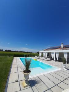 a villa with a swimming pool and a house at Villa Private Pool Luxury G&P in Granarolo dellʼEmilia