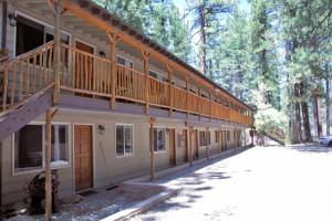 a building with a deck on the side of it at Goldmine Lodge in Big Bear Lake
