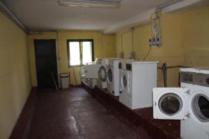 a laundry room with washing machines and a window at casa Luca Prato Verde 1 in Pescasseroli