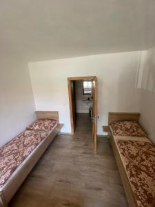 Postel nebo postele na pokoji v ubytování Rodinný penzion Kohoutek
