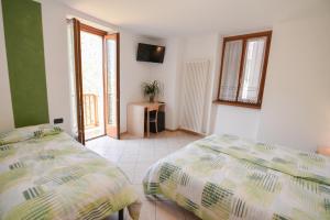 Postel nebo postele na pokoji v ubytování Bed and Breakfast Galet