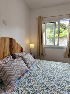 Кровать или кровати в номере The Handmade House Azores