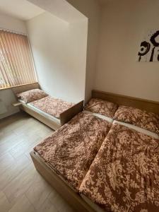 Postel nebo postele na pokoji v ubytování Rodinný penzion Kohoutek