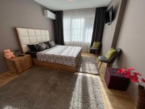 En eller flere senge i et værelse på CityApartment