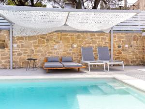 The swimming pool at or close to Villa Evrithea