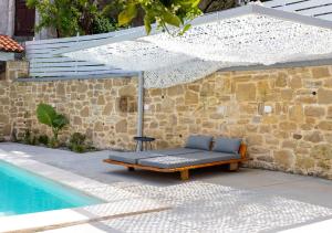 The swimming pool at or close to Villa Evrithea