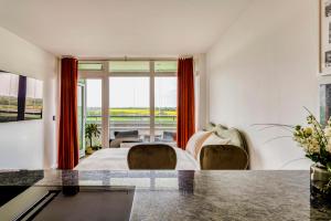 Χώρος καθιστικού στο Apartment im Olympia Hotel Schilksee +12 φωτογραφίες