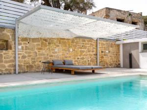 The swimming pool at or close to Villa Evrithea
